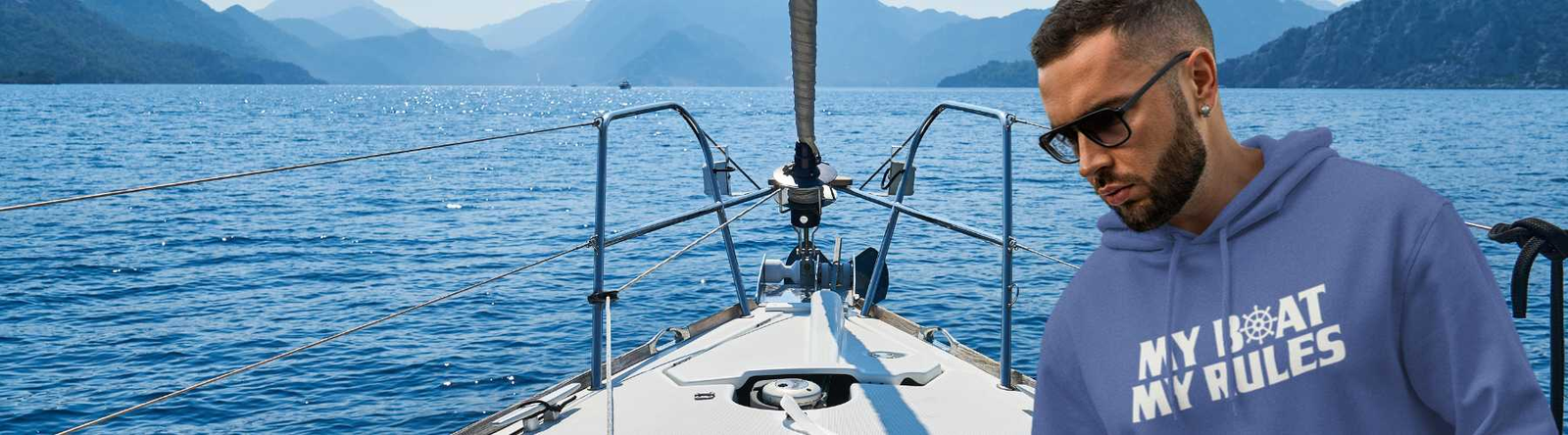 Men’s Beach Hoodies and Sweatshirts - This image is of a man in a blue hoodie with the text My Boat My Rules and the background of a motor boat.   